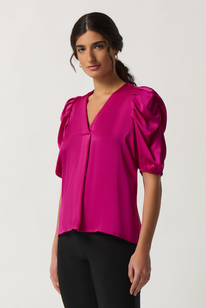 Blusa con mangas abullonadas fucsia 233026