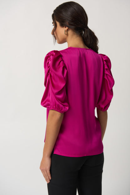 Blusa con mangas abullonadas fucsia 233026
