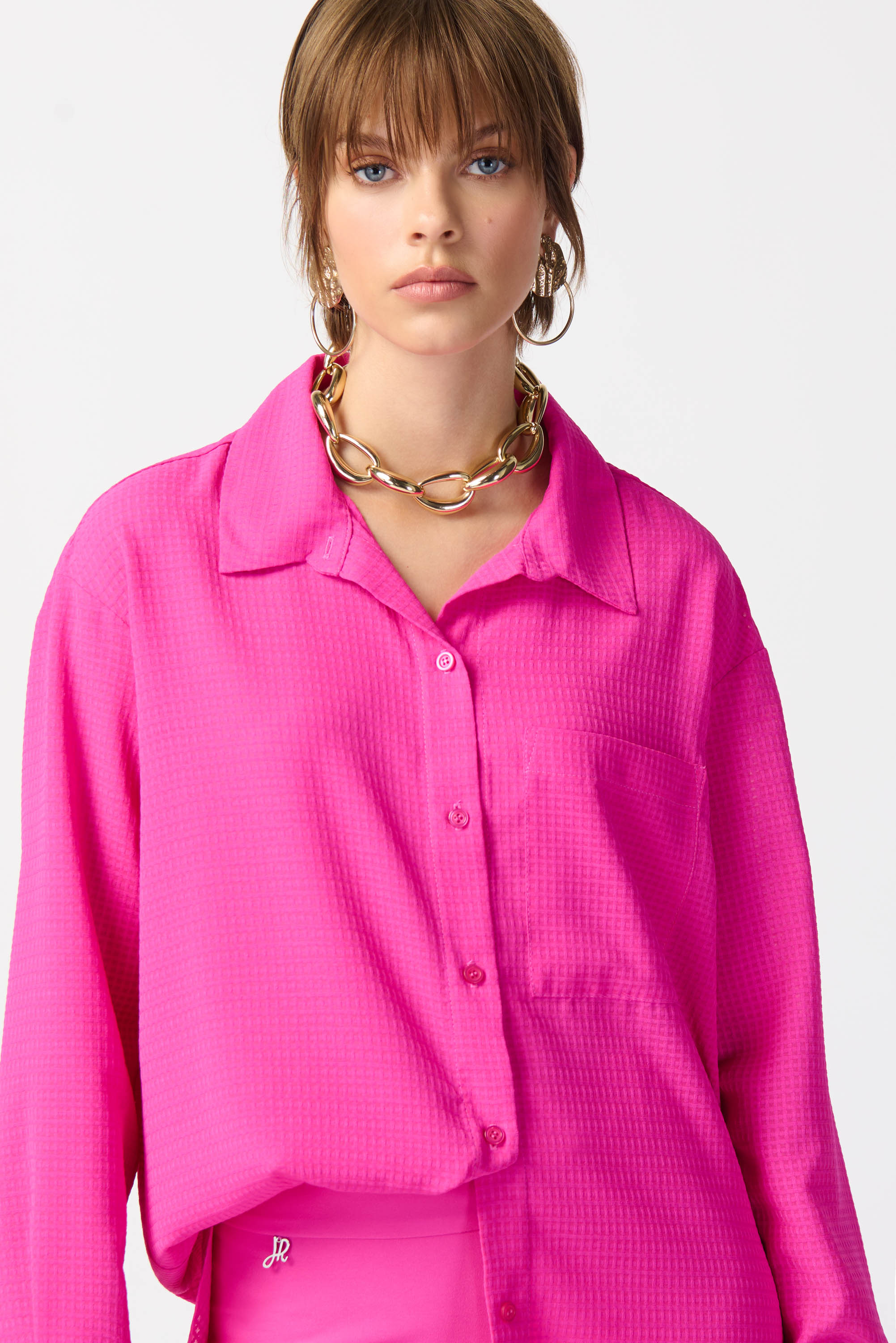 Blusa con textura fucsia 241259