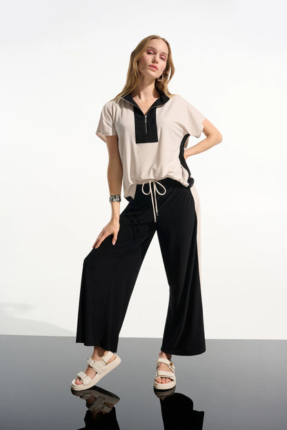 Top recto de punto sedoso con bloques de color y cuello con cremallera negro y beige 261611