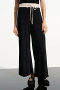 Pantalón sin cierres de pierna ancha en punto sedoso con bloques de color negro y beige 261612